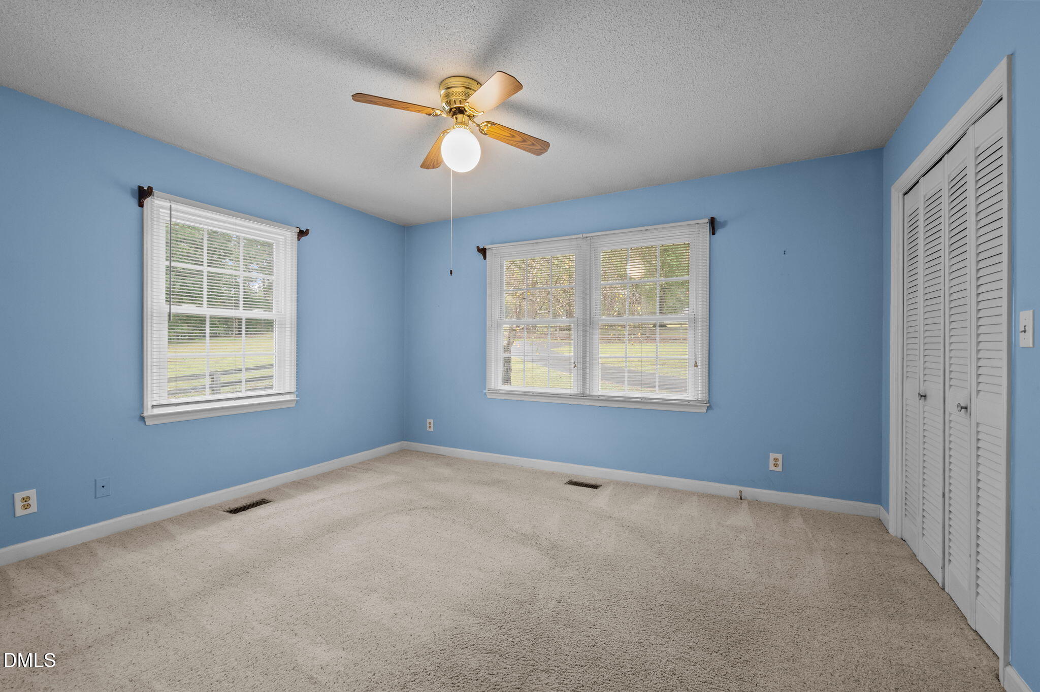 7105 Guess Road Hillsborough, NC 27278 - Photo 25 of 47 an empty room with windows and fan