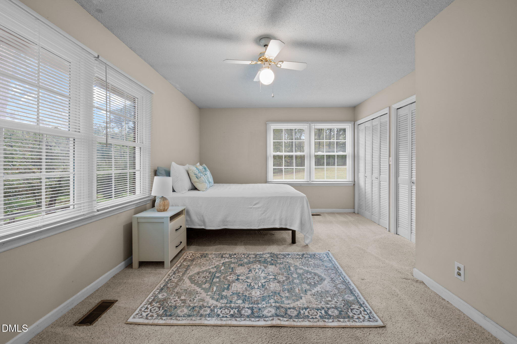 7105 Guess Road Hillsborough, NC 27278 - Photo 26 of 47 a bedroom with a bed a couch and large window with outer view