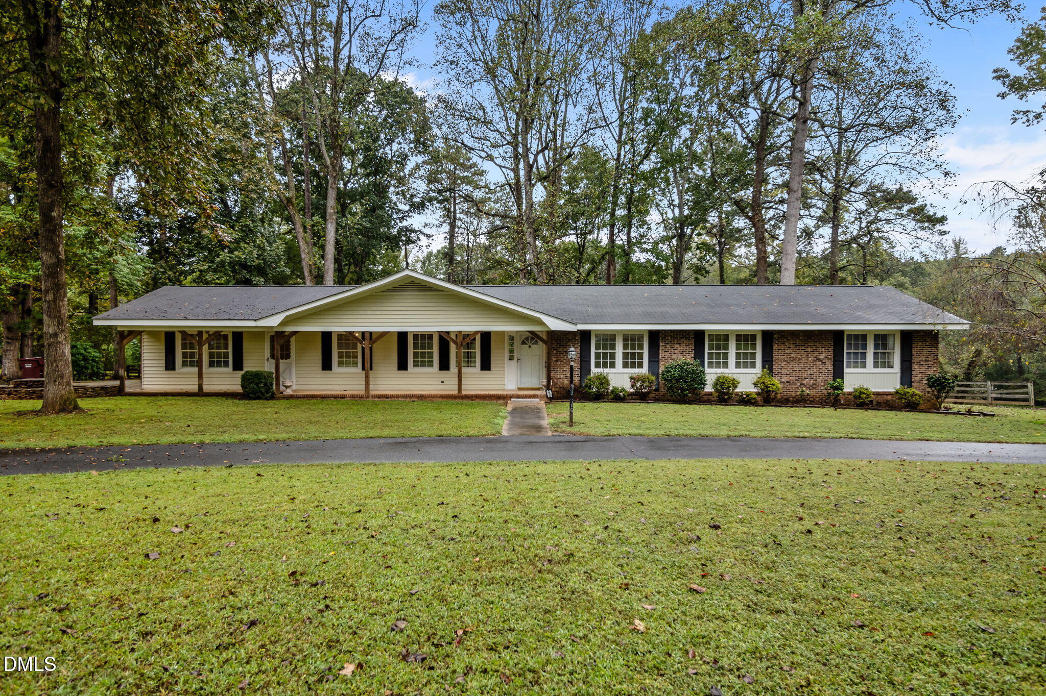 7105 Guess Road Hillsborough, NC 27278 - Photo 2 of 47 a front view of a house with a garden