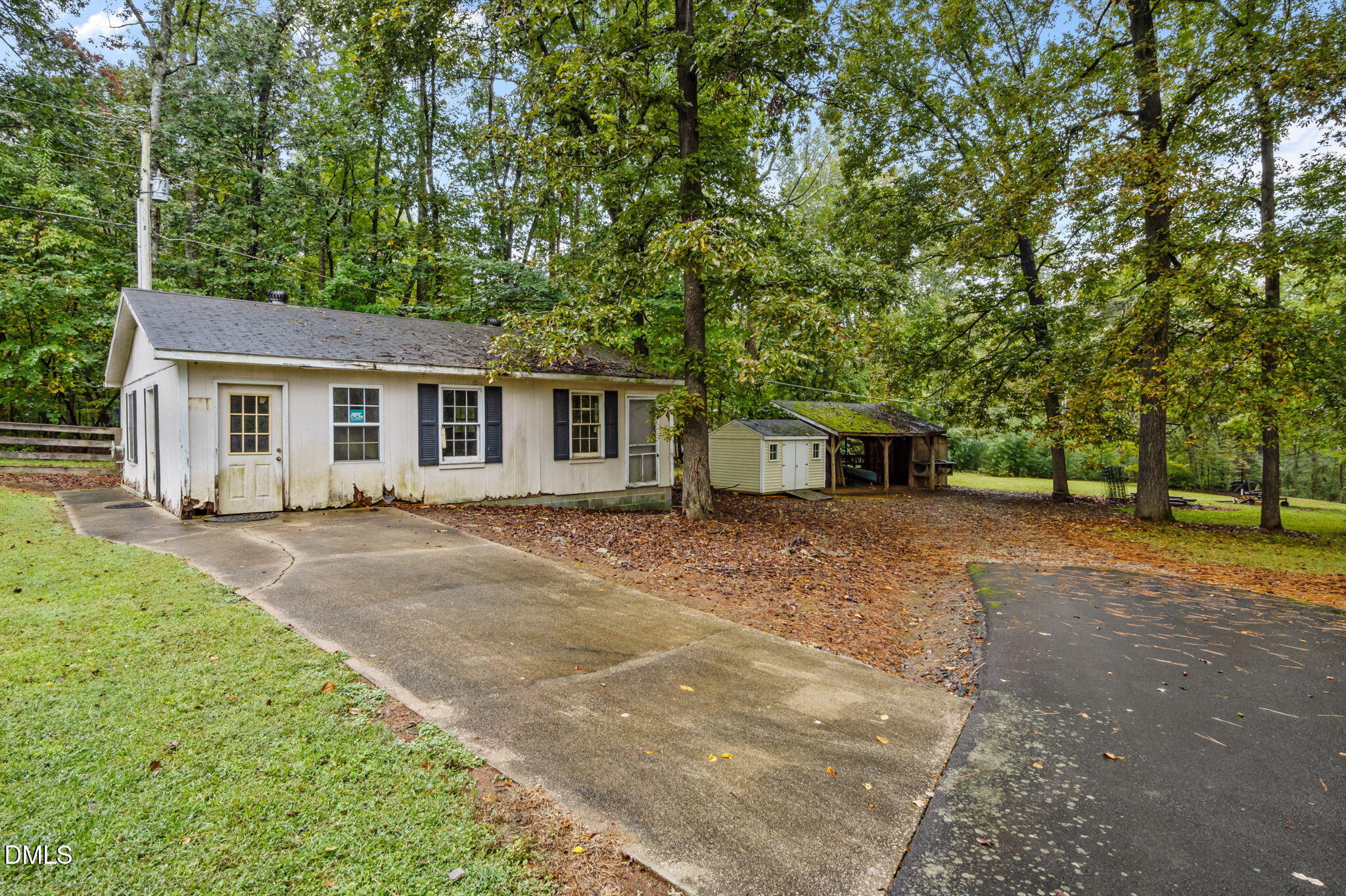 7105 Guess Road Hillsborough, NC 27278 - Photo 34 of 47 a front view of a house with a garden and trees