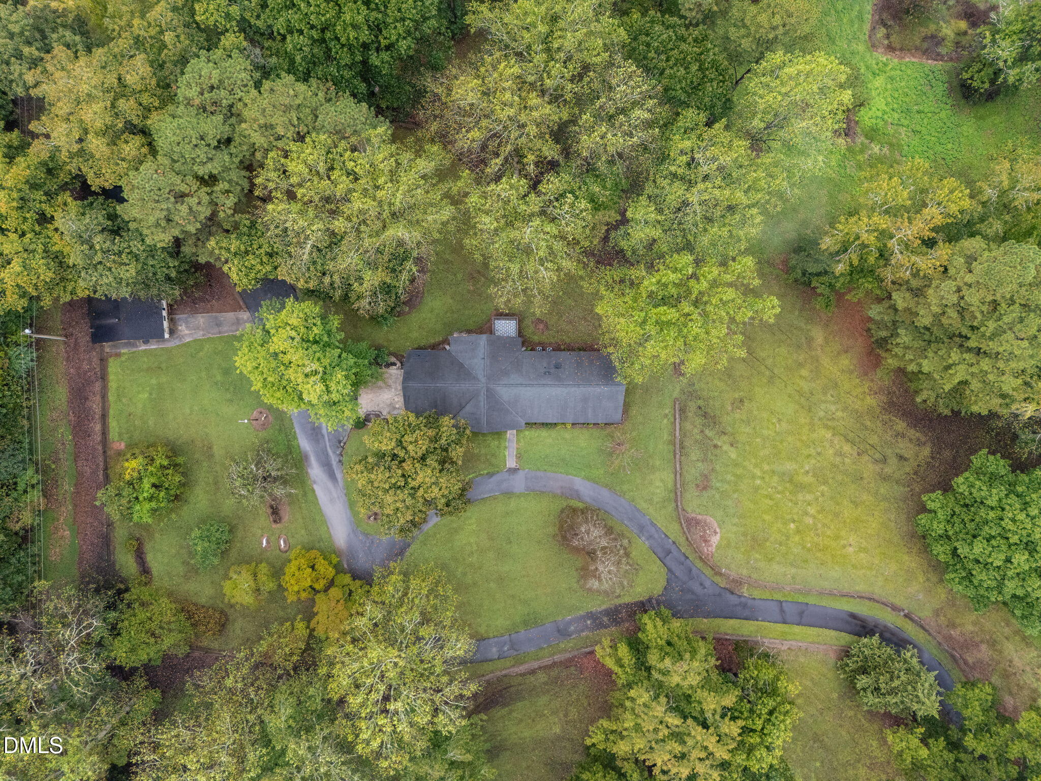 7105 Guess Road Hillsborough, NC 27278 - Photo 45 of 47 a view of a garden with a fountain