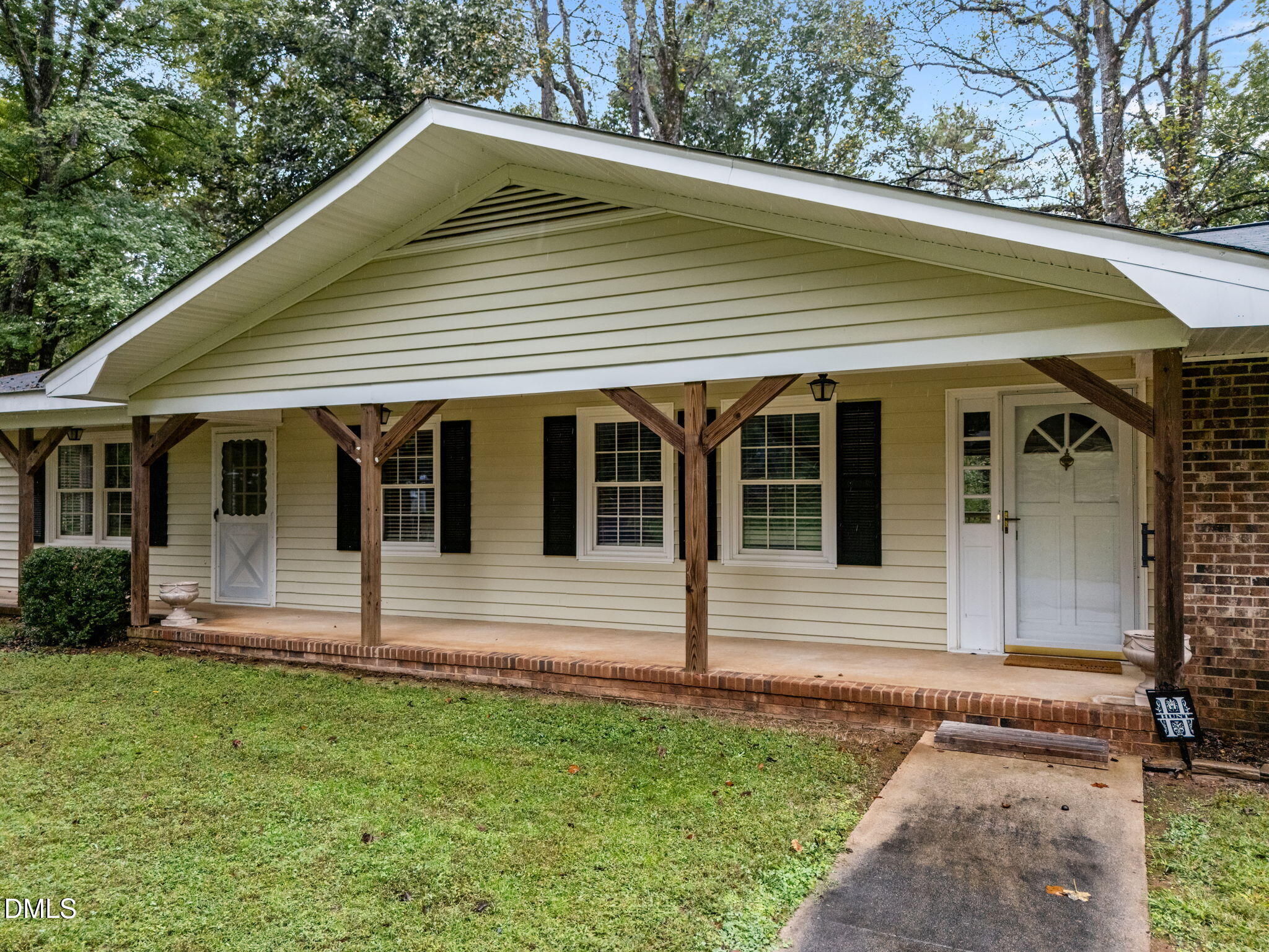 7105 Guess Road Hillsborough, NC 27278 - Photo 6 of 47 a front view of a house with a yard