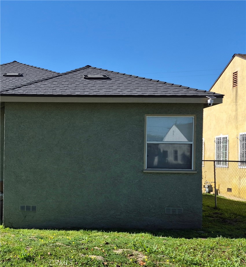 1822 East Stockton Street Compton, CA 90221 - Photo 1 of 1 a front view of a house with a yard