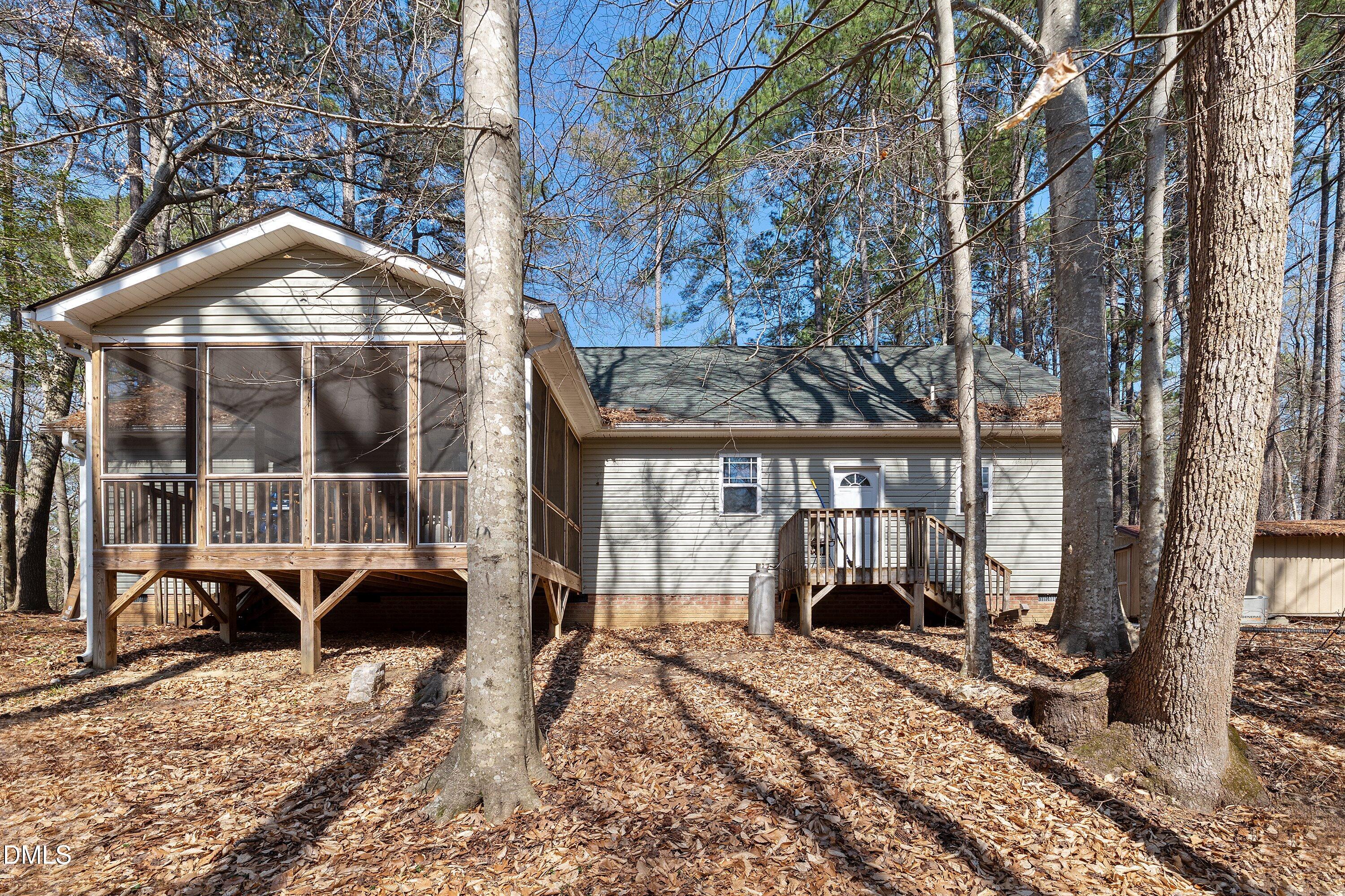 9713 Lake Wheeler Road Raleigh, NC 27603 - Photo 17 of 18 a view of a house with a backyard