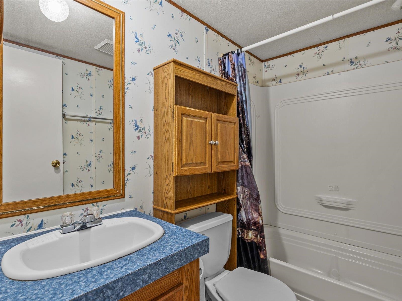 435 32 Road, Unit 713 Clifton, CO 81520 - Photo 13 of 17 a bathroom with a granite countertop sink toilet and shower