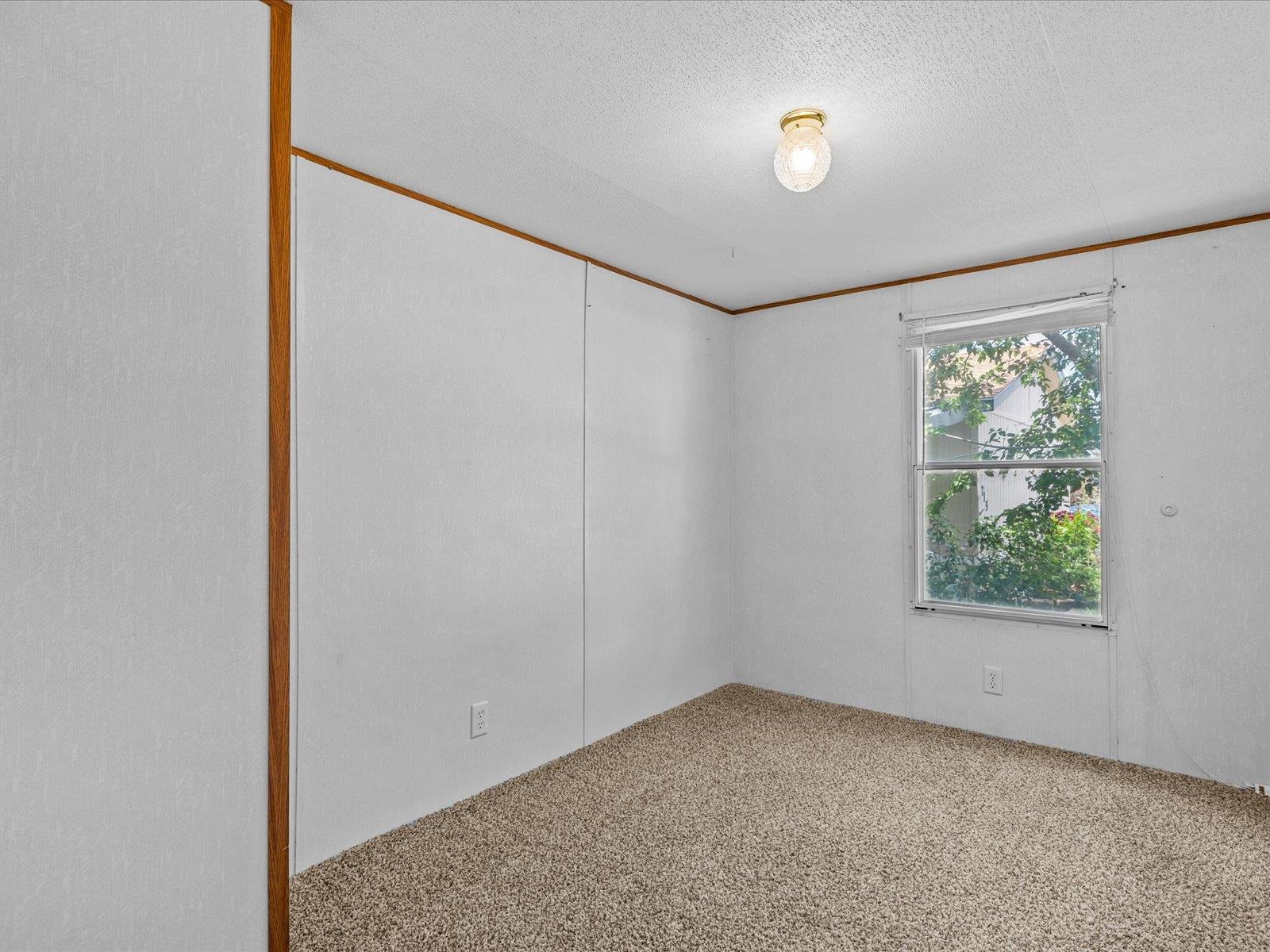 435 32 Road, Unit 713 Clifton, CO 81520 - Photo 14 of 17 an empty room with windows and closet