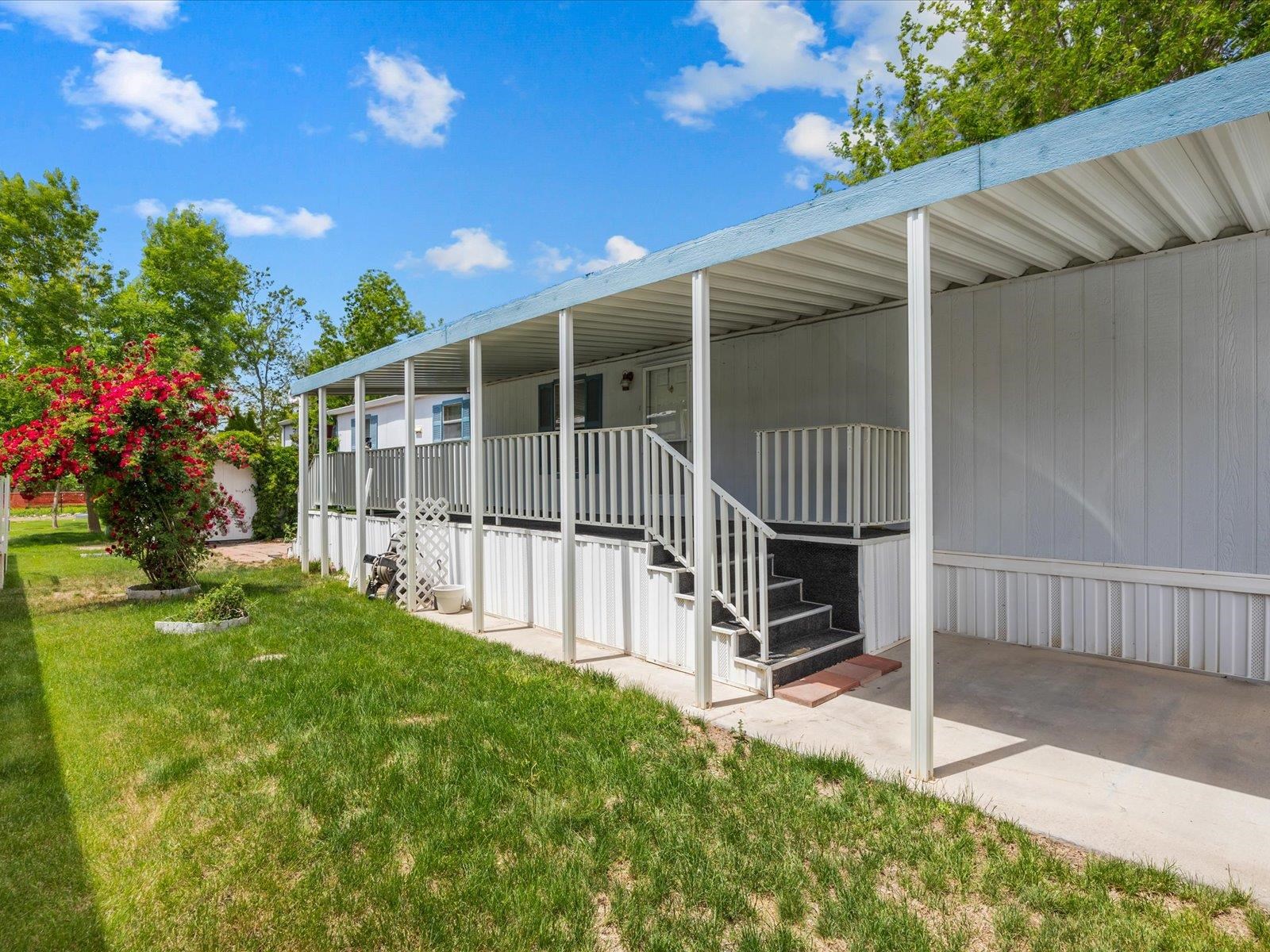 435 32 Road, Unit 713 Clifton, CO 81520 - Photo 2 of 17 a view of backyard with deck and garden