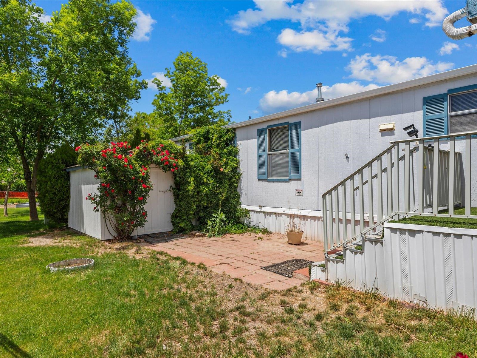 435 32 Road, Unit 713 Clifton, CO 81520 - Photo 3 of 17 a view of a house with backyard and sitting area