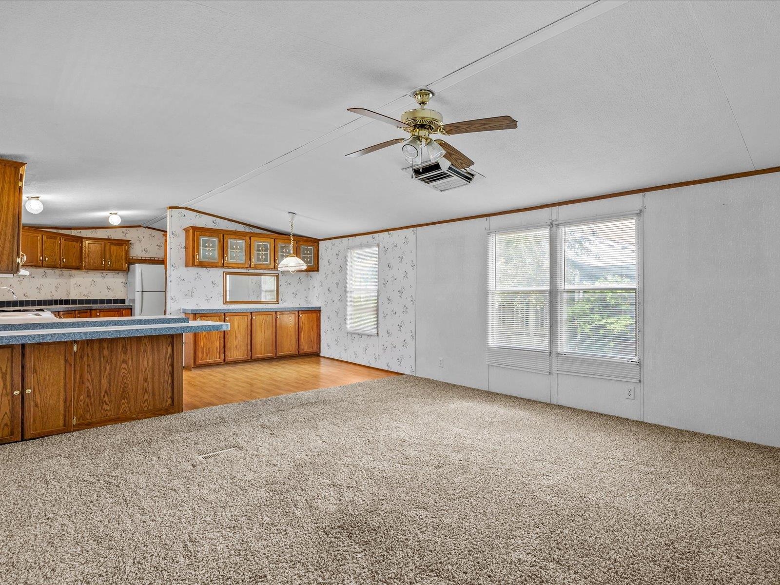 435 32 Road, Unit 713 Clifton, CO 81520 - Photo 5 of 17 a view of a kitchen with a sink and a window