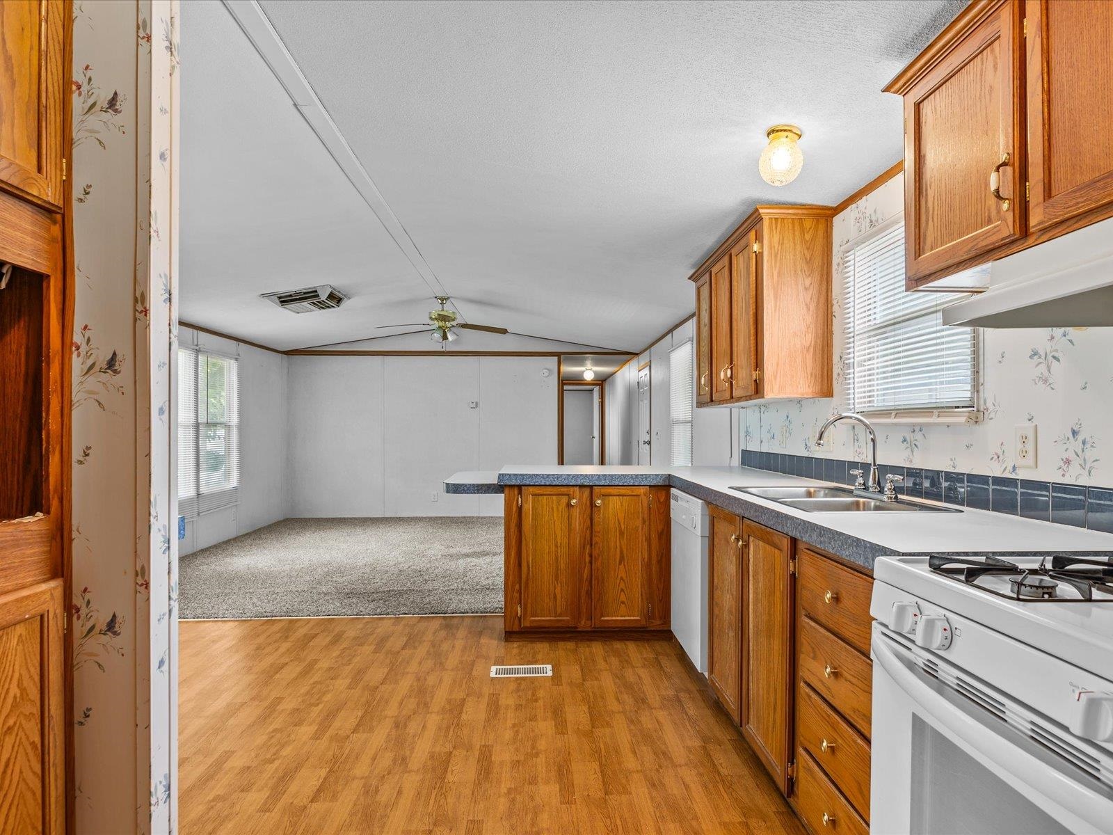435 32 Road, Unit 713 Clifton, CO 81520 - Photo 7 of 17 a kitchen with stainless steel appliances granite countertop a sink stove and refrigerator