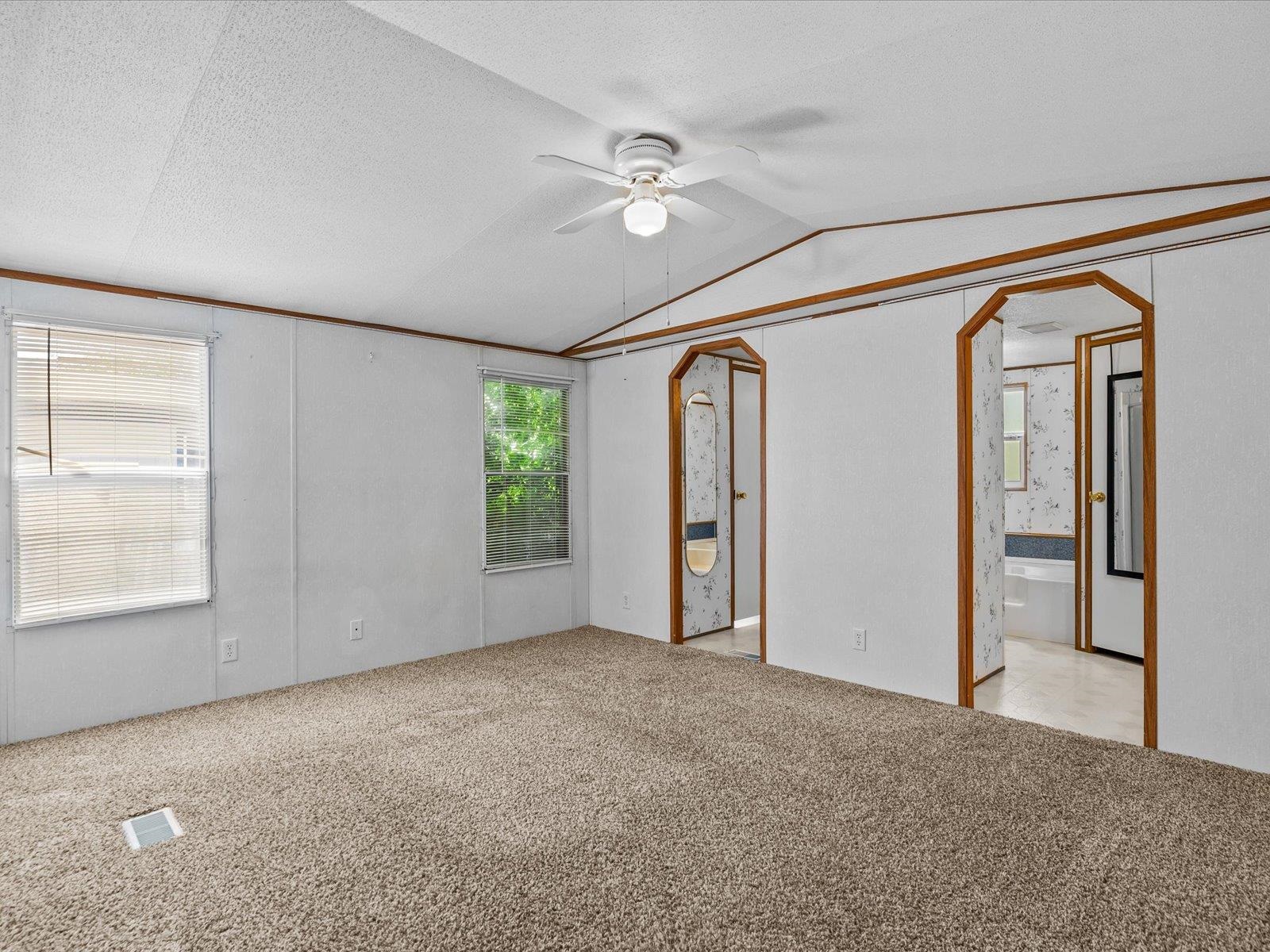 435 32 Road, Unit 713 Clifton, CO 81520 - Photo 8 of 17 an empty room with windows and closet