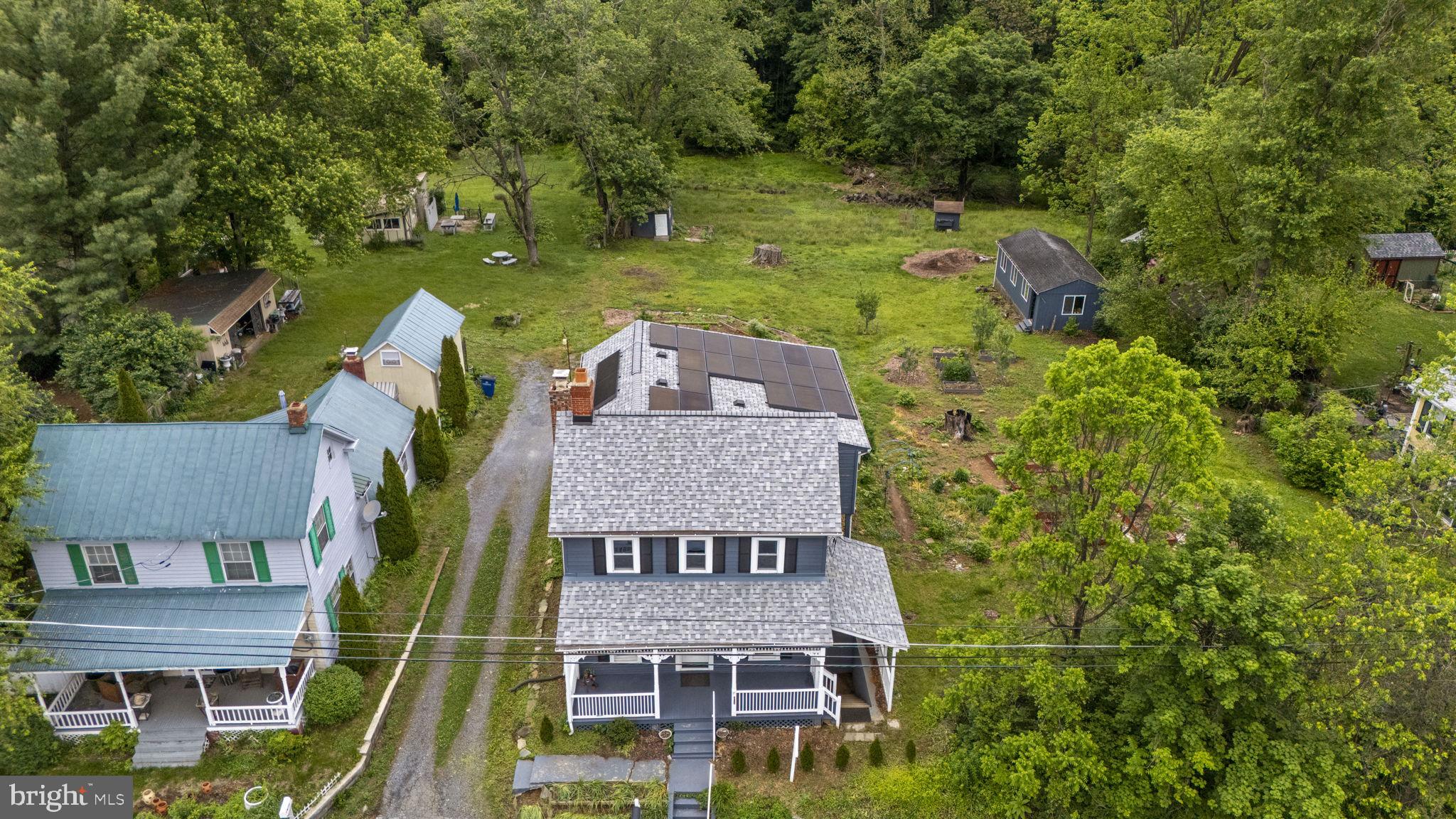 26001 Frederick Road Clarksburg, MD 20871 - Photo 41 of 46 an aerial view of a house with a garden and plants