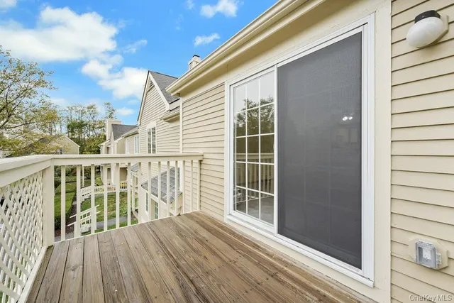 a view of a balcony with wooden floor
