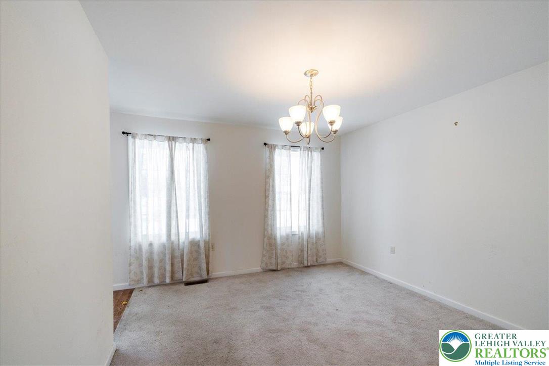 209 Buck Road East Stroudsburg, PA 18302 - Photo 11 of 25 wooden floor in an empty room with a window