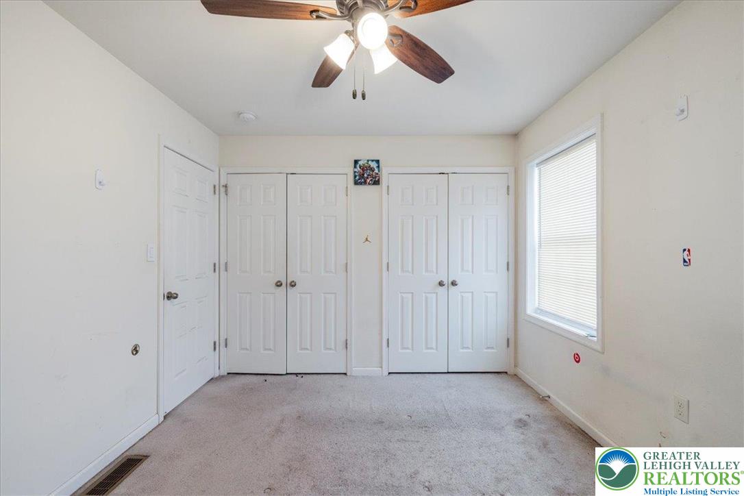209 Buck Road East Stroudsburg, PA 18302 - Photo 16 of 25 a view of an empty room and chandelier fan
