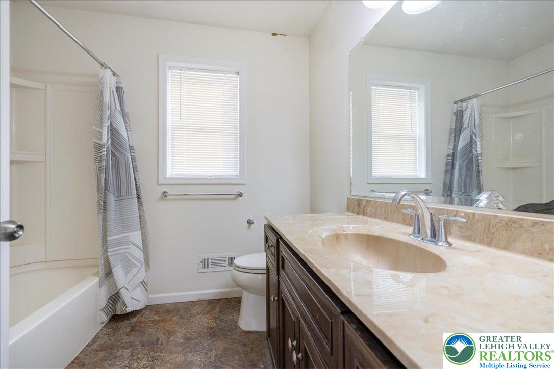 209 Buck Road East Stroudsburg, PA 18302 - Photo 21 of 25 a bathroom with a sink a toilet and bathtub