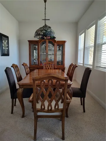 a bedroom with bed and a chandelier