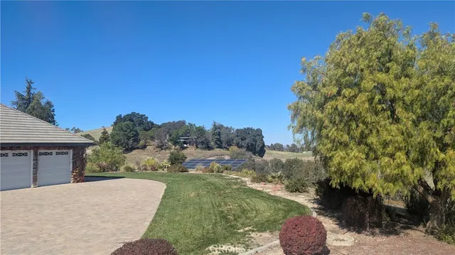 a view of a lake with houses in the back