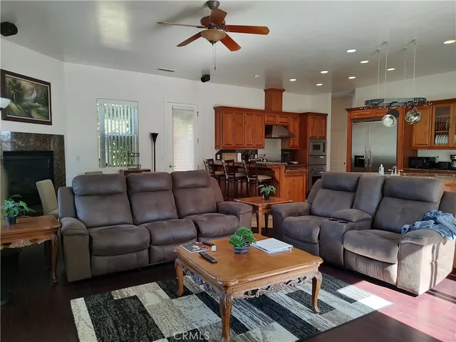 a kitchen with granite countertop a sink and cabinets
