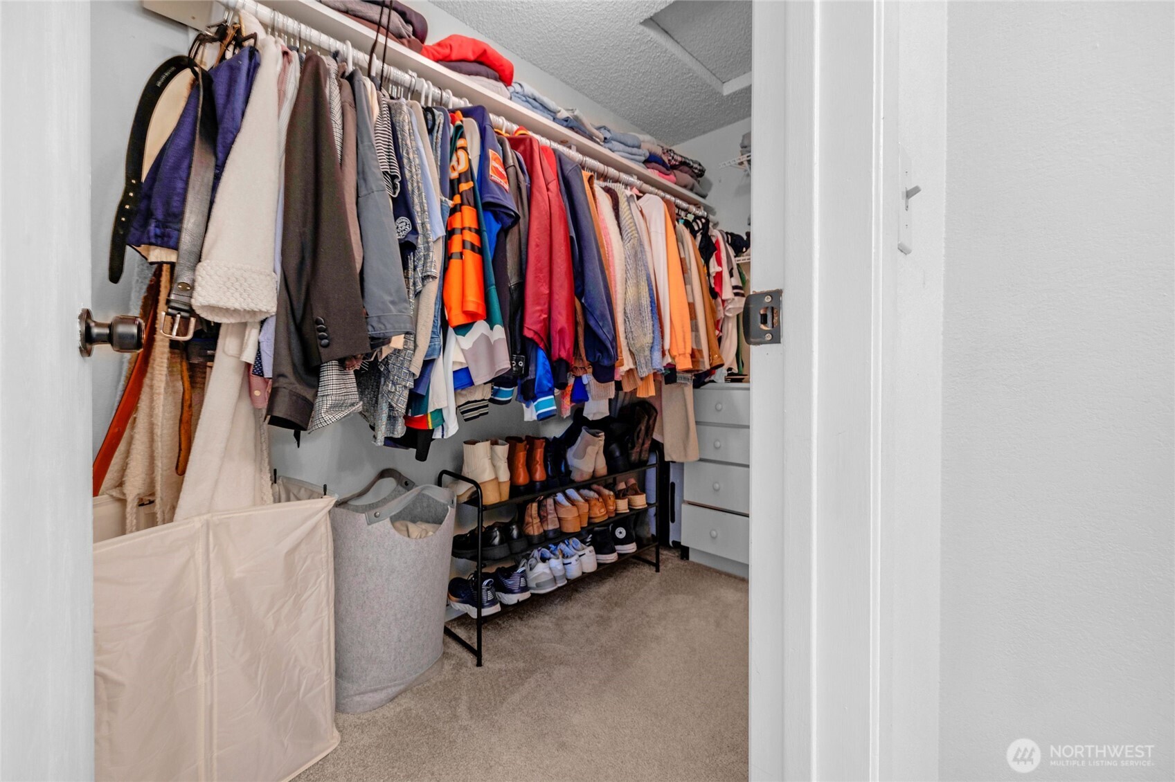 820 Cady Road, Unit A305 Everett, WA 98203 - Photo 16 of 33 a view of walk in closet with clothes and shoes