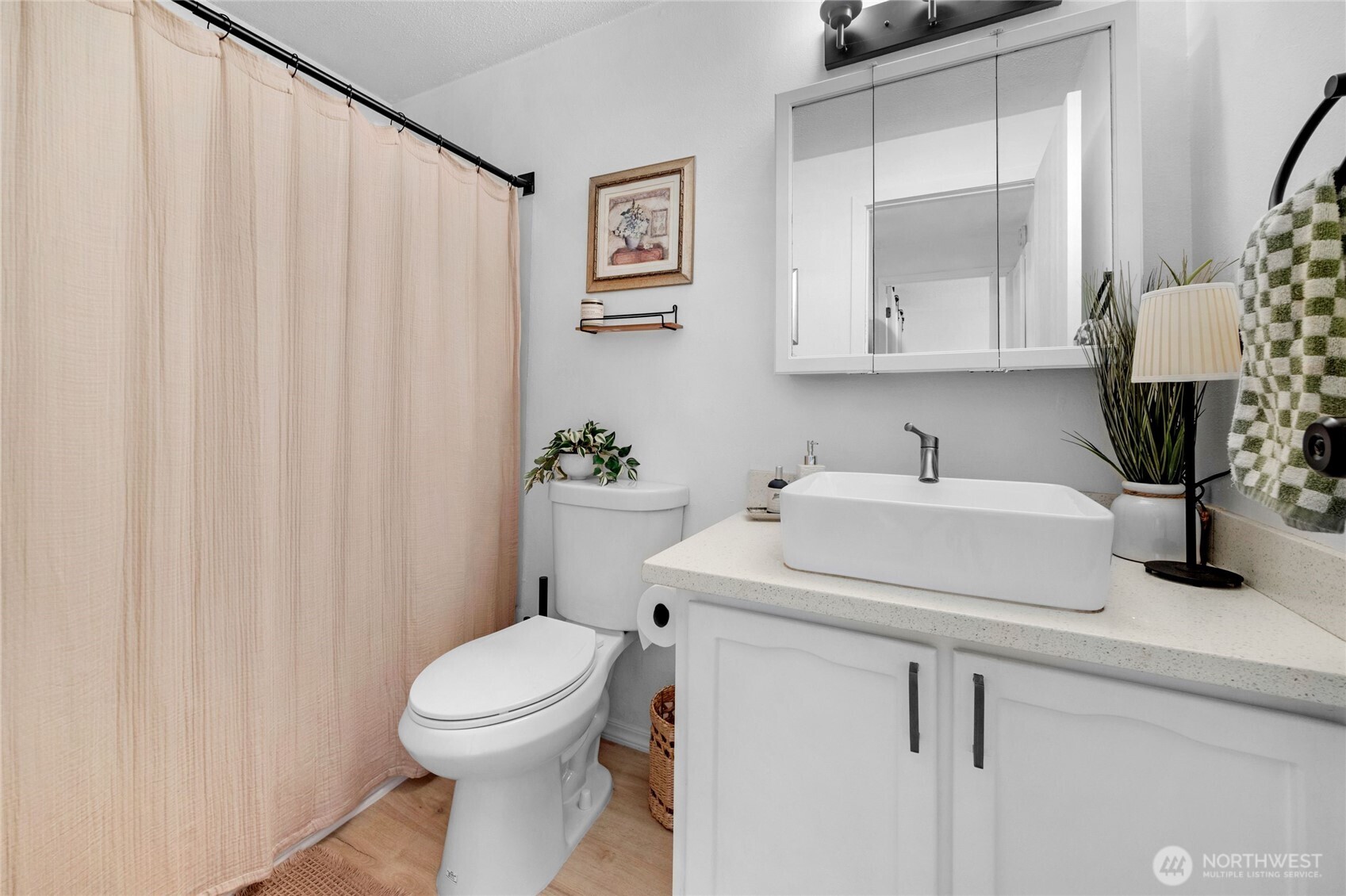 820 Cady Road, Unit A305 Everett, WA 98203 - Photo 17 of 33 a bathroom with a sink a toilet and shower curtain