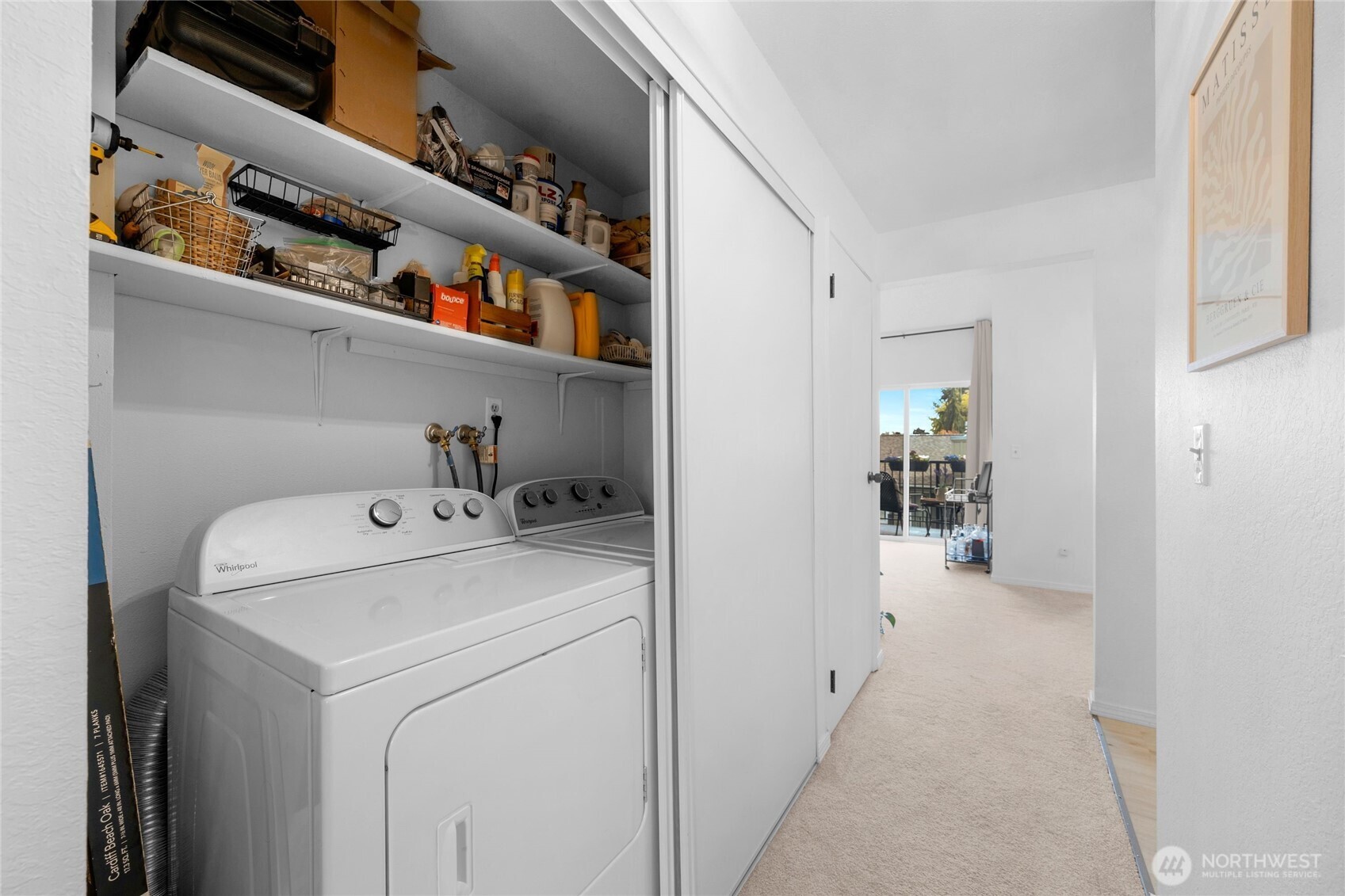 820 Cady Road, Unit A305 Everett, WA 98203 - Photo 18 of 33 a view of washer and dryer with kitchen in the background