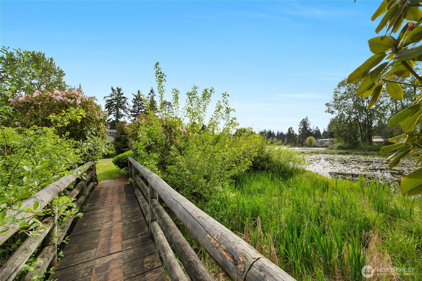 820 Cady Road, Unit A305 Everett, WA 98203 - Photo 23 of 33 a view of a lake with a floor to ceiling window