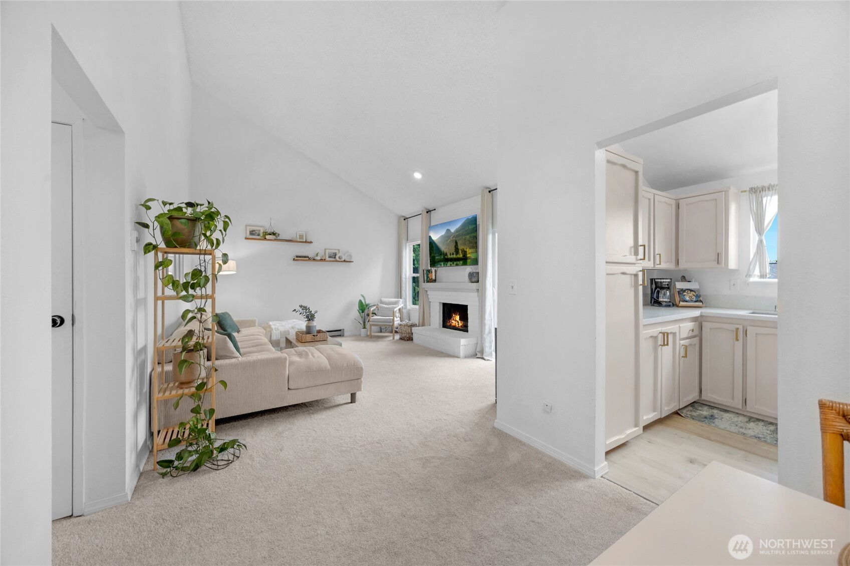 820 Cady Road, Unit A305 Everett, WA 98203 - Photo 4 of 33 a living room with furniture and a kitchen