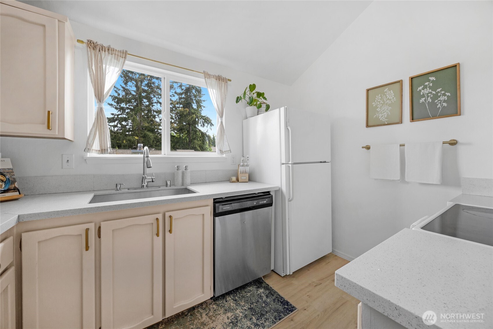 820 Cady Road, Unit A305 Everett, WA 98203 - Photo 6 of 33 a kitchen with a sink cabinets and window