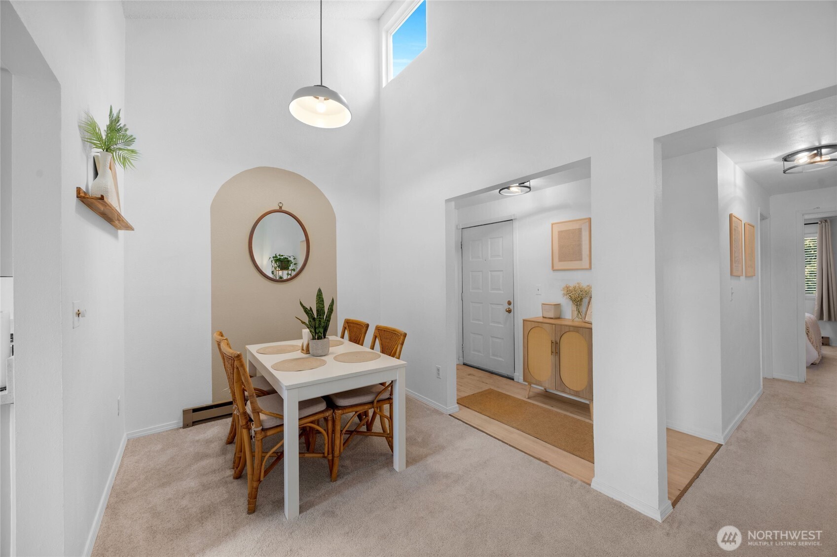 820 Cady Road, Unit A305 Everett, WA 98203 - Photo 7 of 33 a view of a dining room with furniture and a chandelier