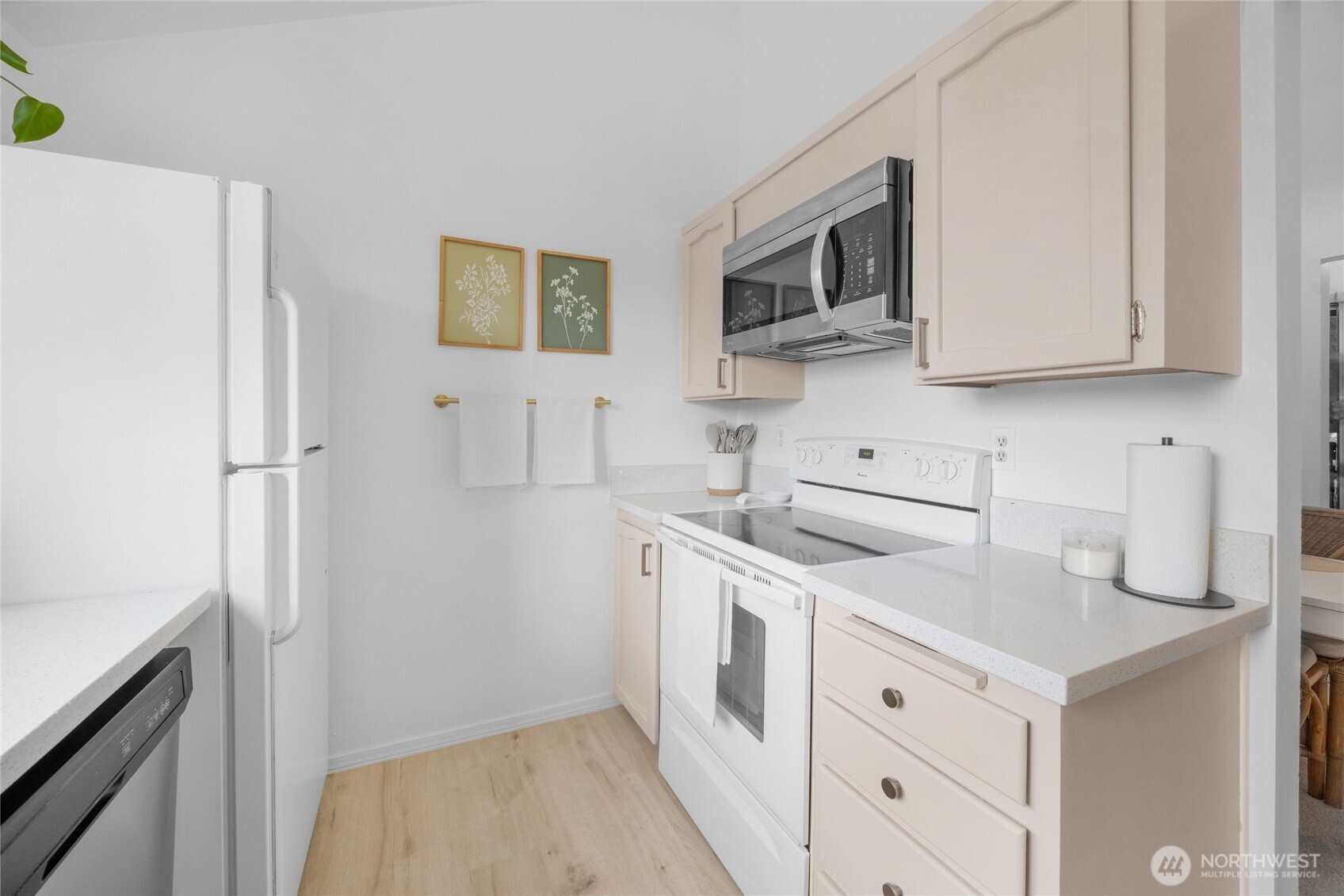 820 Cady Road, Unit A305 Everett, WA 98203 - Photo 8 of 33 a kitchen with stainless steel appliances white cabinets and a refrigerator
