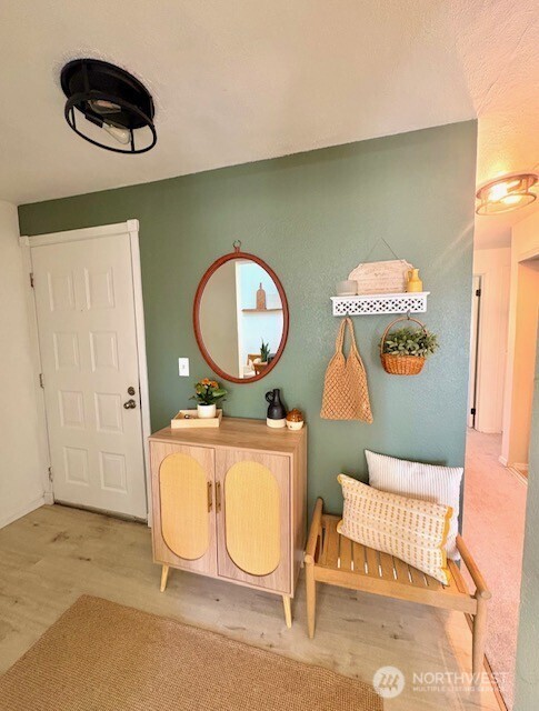 820 Cady Road, Unit A305 Everett, WA 98203 - Photo 9 of 33 a living room with furniture and a wooden floor