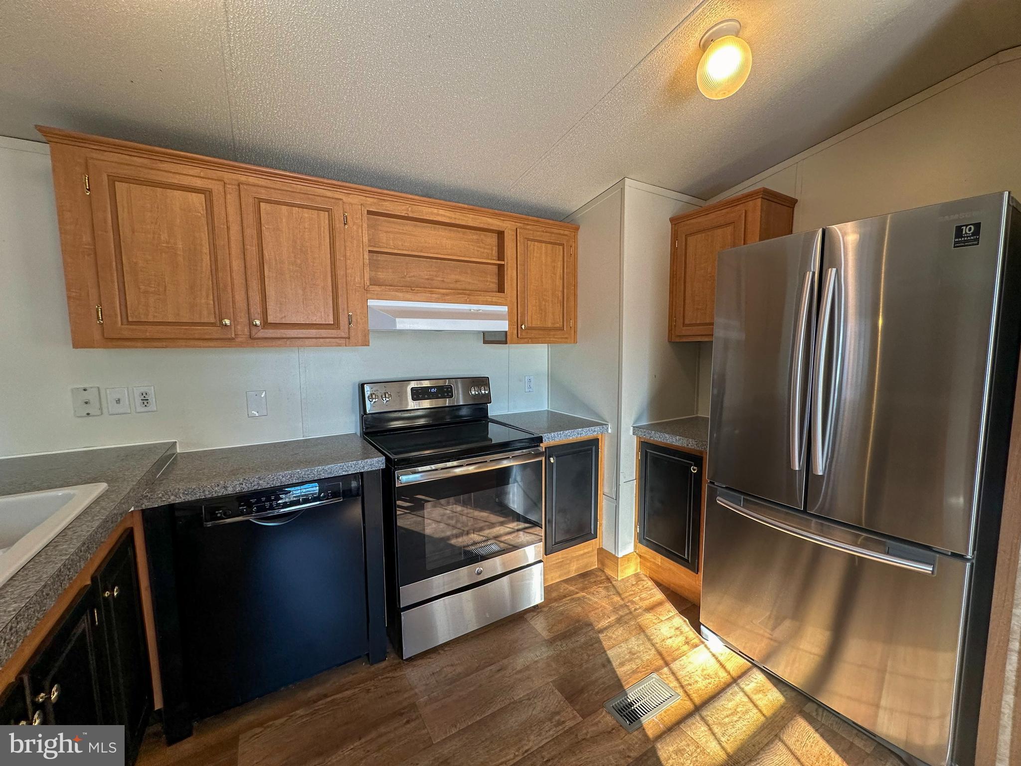 760 Azalea Lane Gap, PA 17527 - Photo 22 of 32 a kitchen with stainless steel appliances granite countertop a refrigerator stove and sink