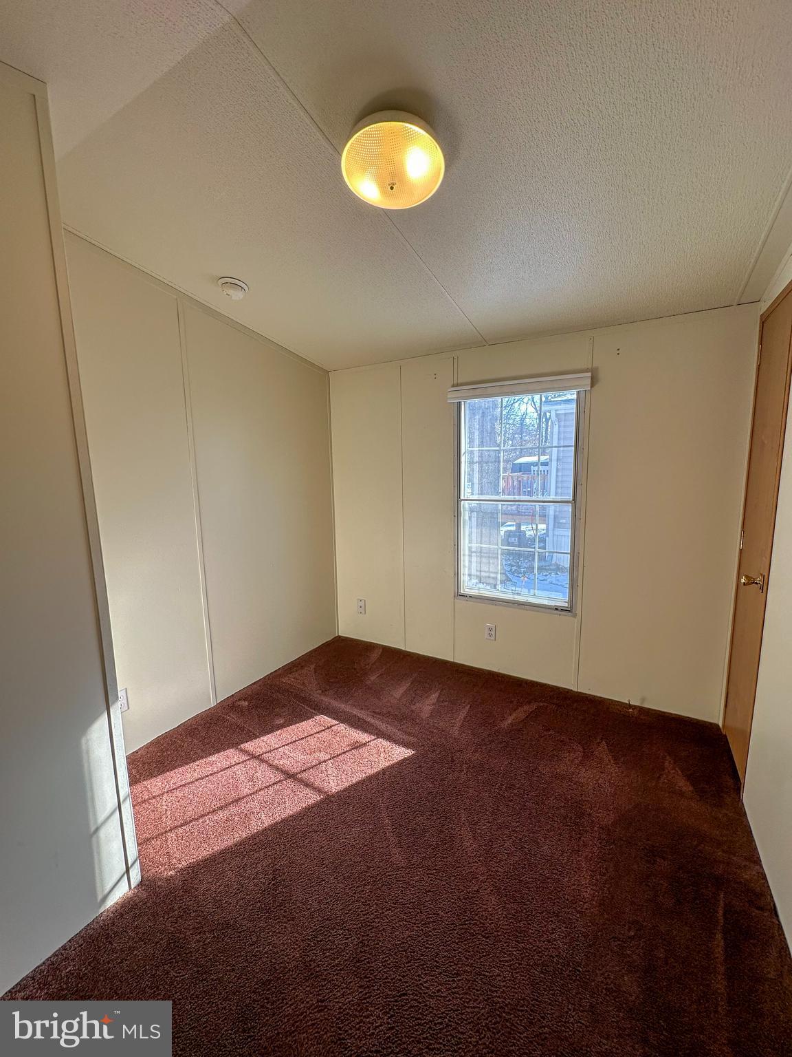 760 Azalea Lane Gap, PA 17527 - Photo 30 of 32 a view of an empty room with window and wooden floor