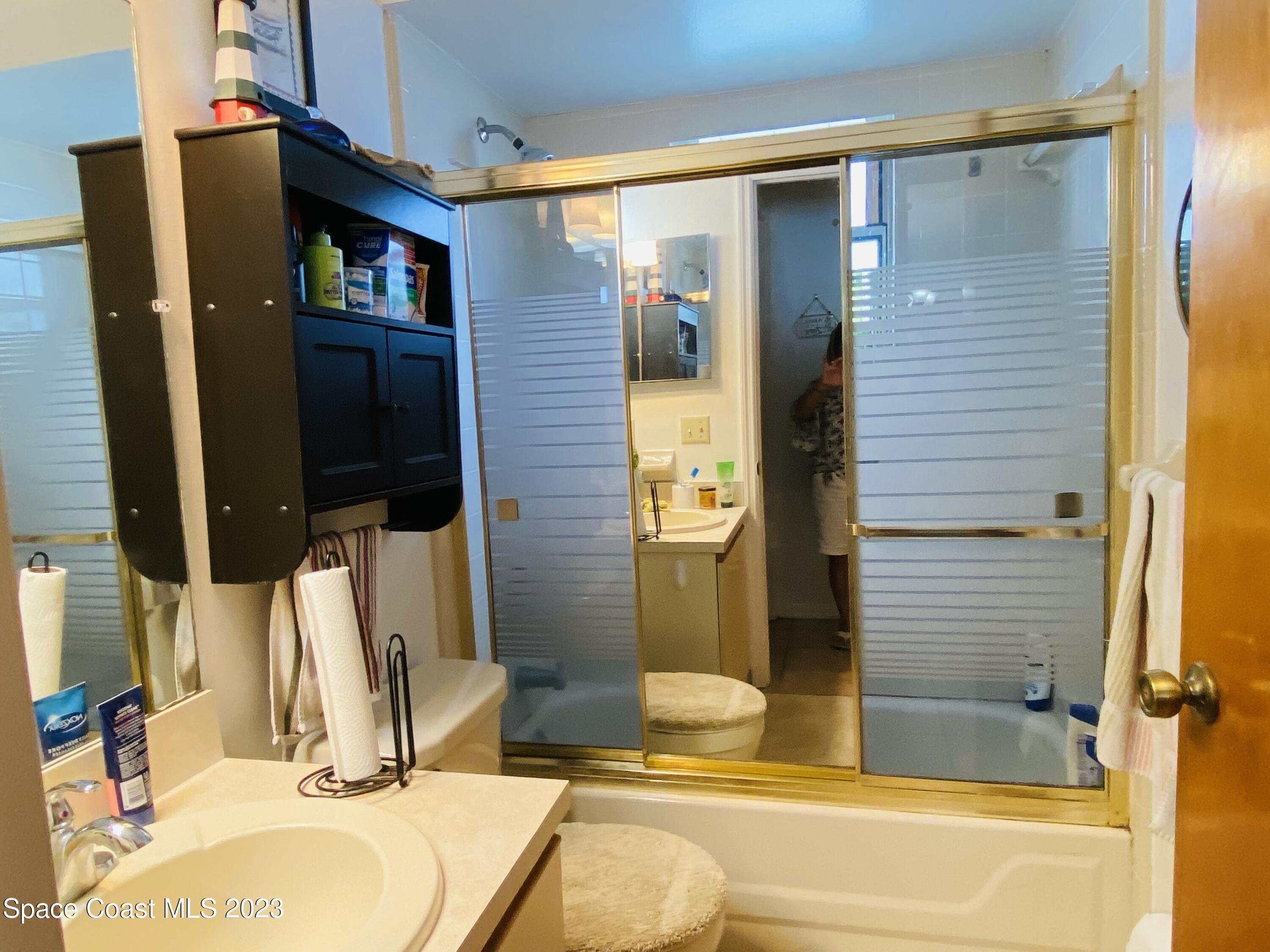 3985 Bayberry Drive Melbourne, FL 32901 - Photo 12 of 13 a bathroom with a tub and sink