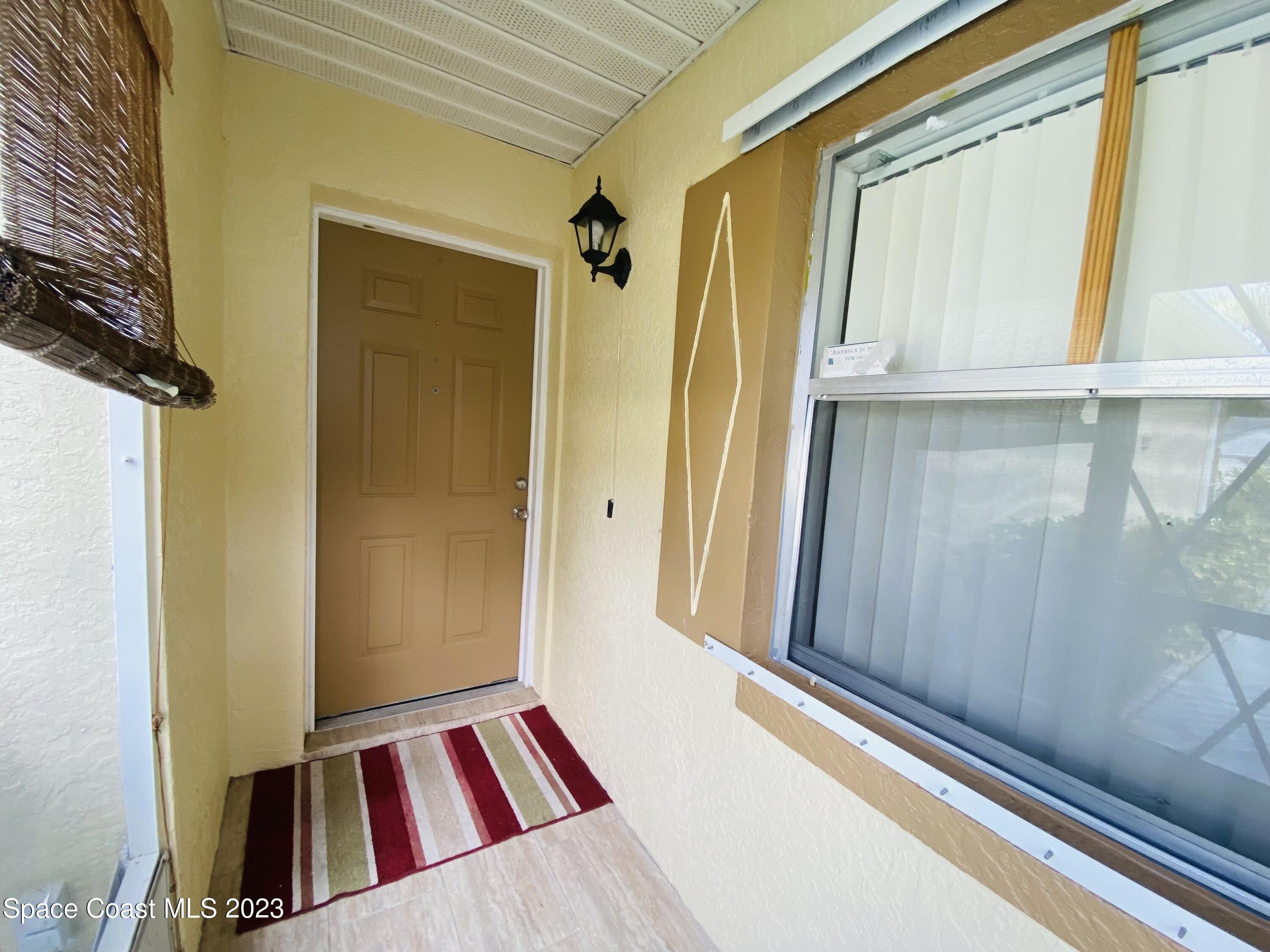 3985 Bayberry Drive Melbourne, FL 32901 - Photo 3 of 13 a view of an front door