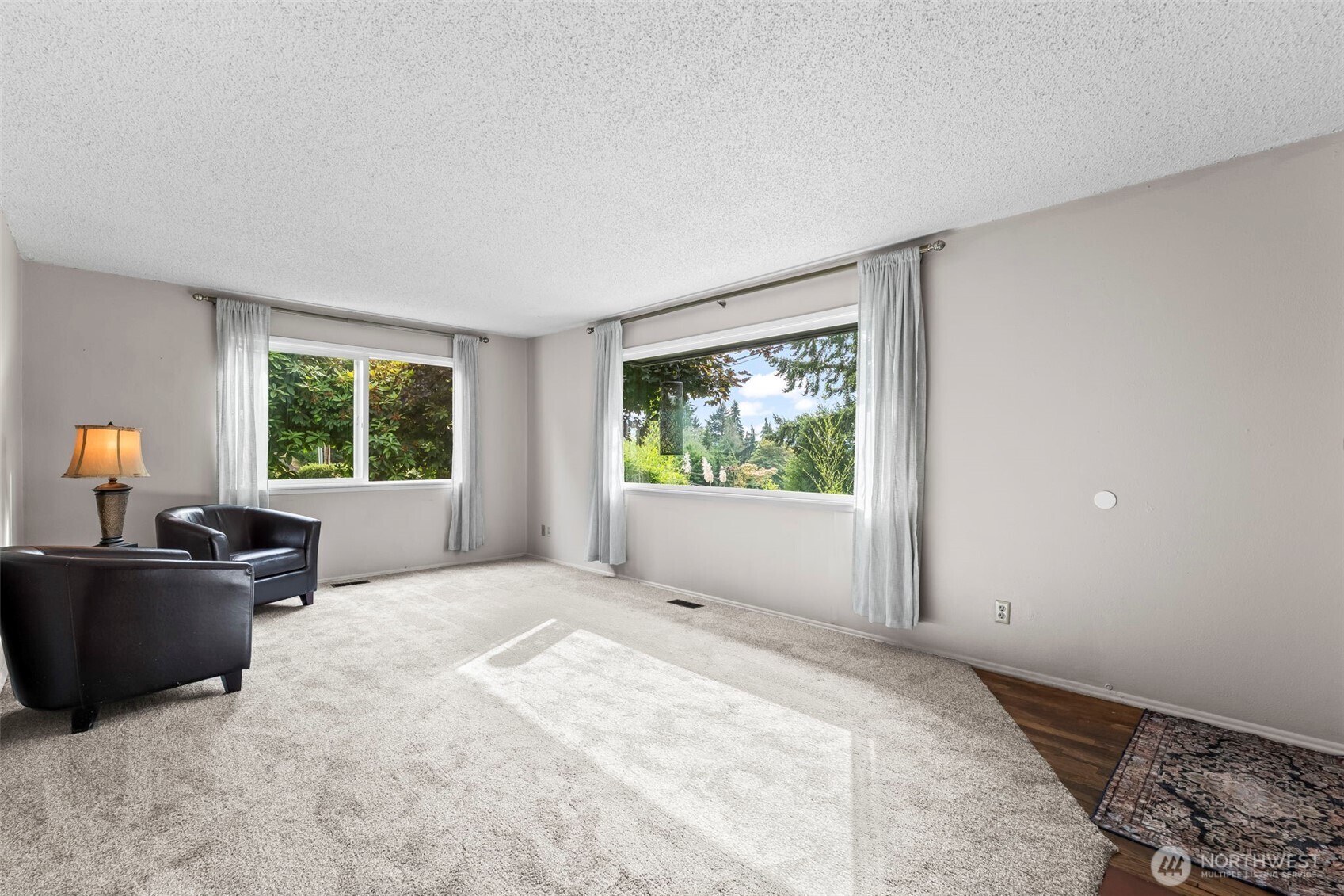 4403 Paradise Avenue West University Place, WA 98466 - Photo 11 of 35 a view of a room with a large window and a kitchen view