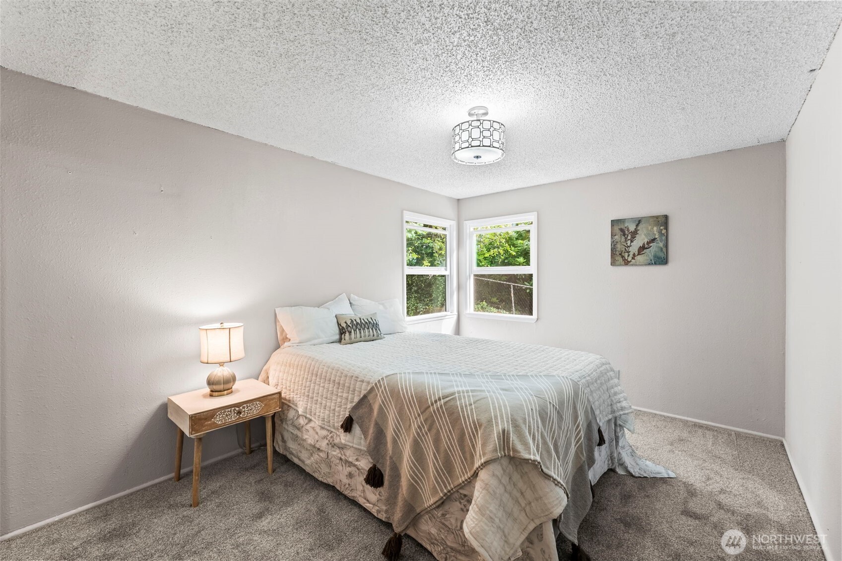 4403 Paradise Avenue West University Place, WA 98466 - Photo 21 of 35 a bedroom with a bed and a table