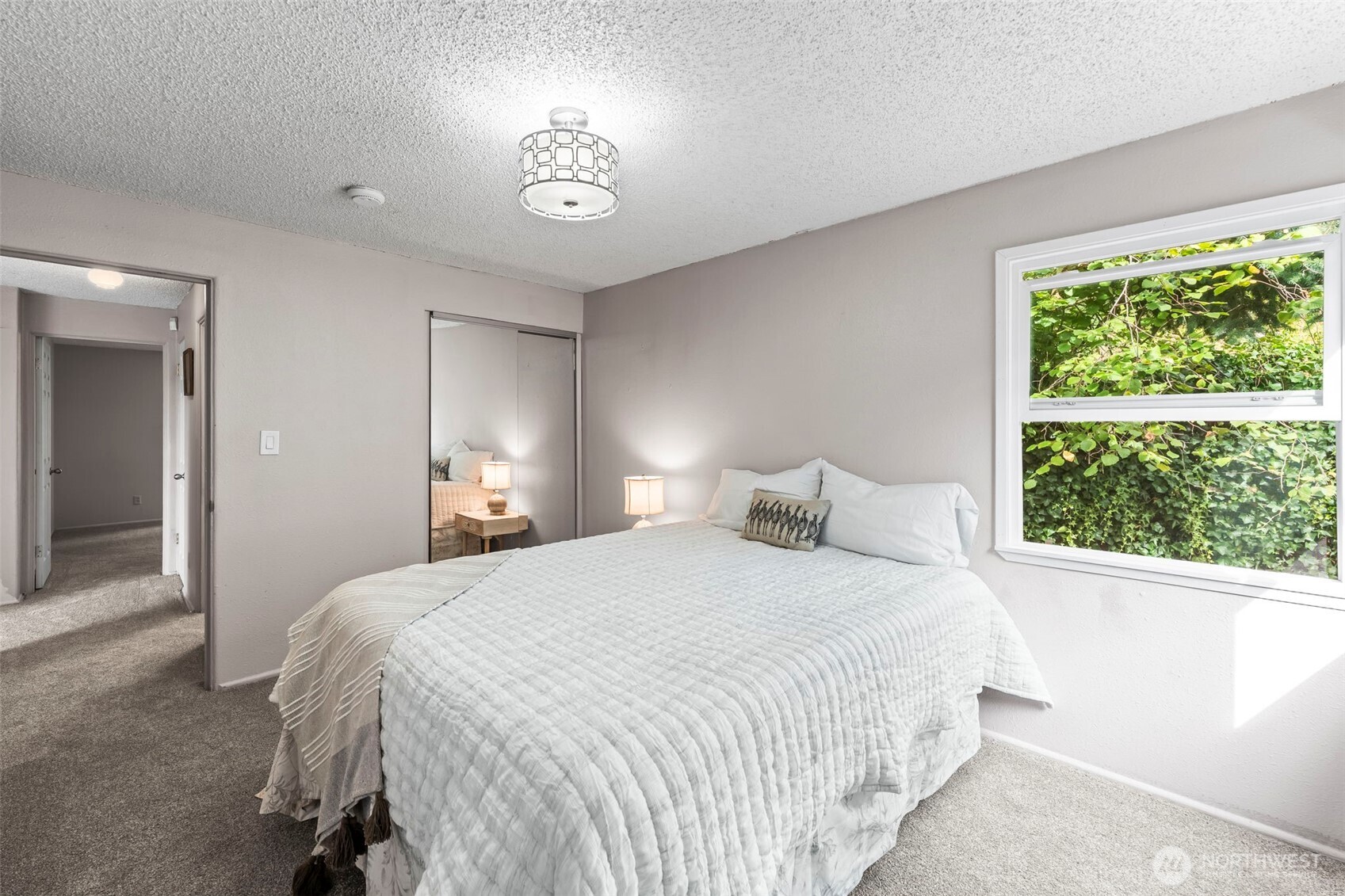 4403 Paradise Avenue West University Place, WA 98466 - Photo 22 of 35 a bedroom with a bed and a window