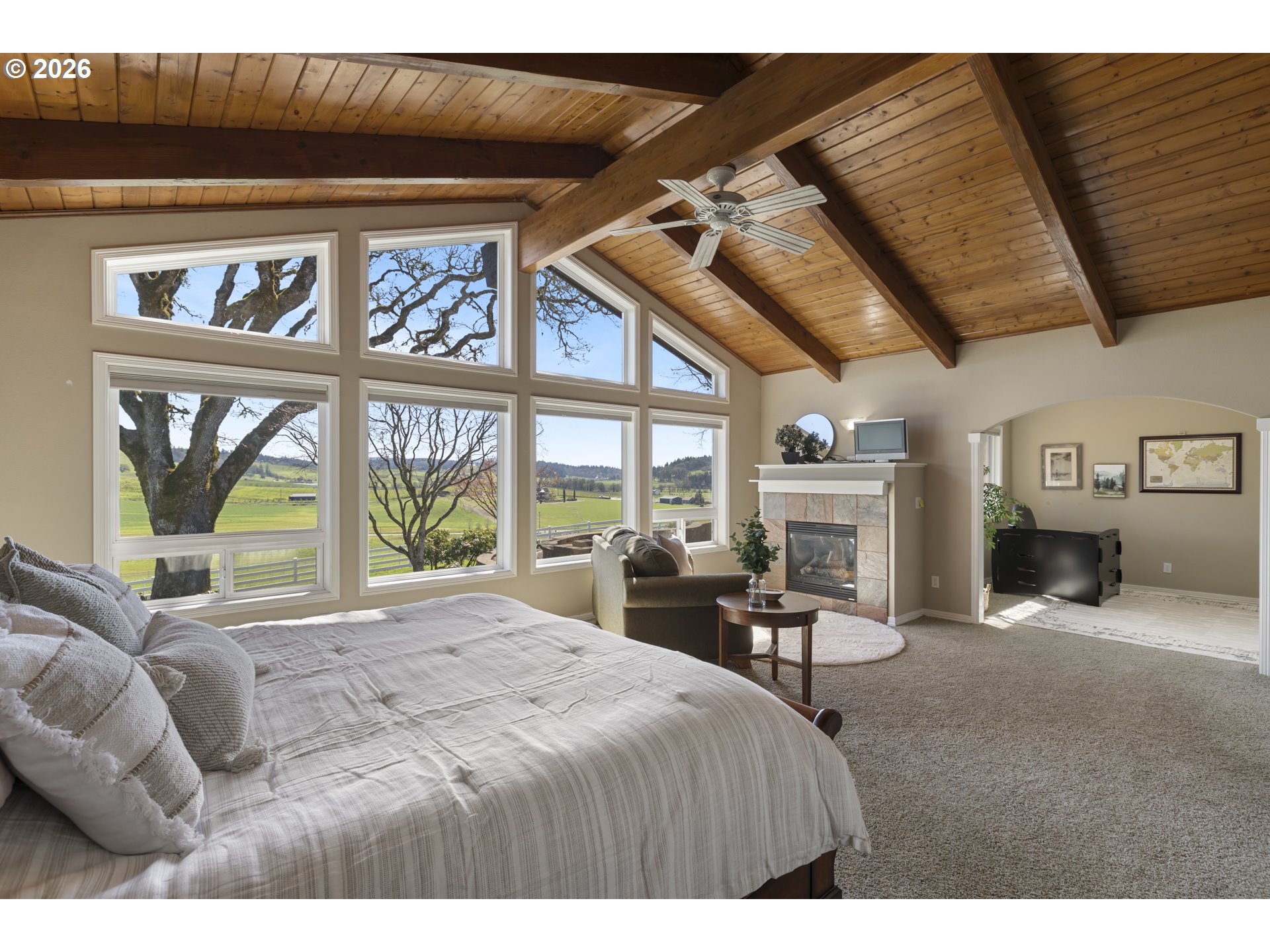 17795 Northeast Laughlin Road Yamhill, OR 97148 - Photo 15 of 48 a large bedroom with a bed and a large window
