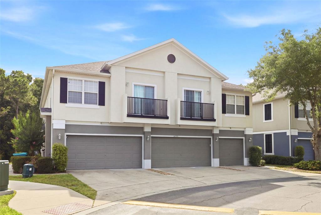 6458 South Goldenrod Road, Unit 29B Orlando, FL 32822 - Photo 2 of 40 a front view of a house with a yard
