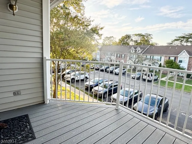 a view of a balcony with wooden floor