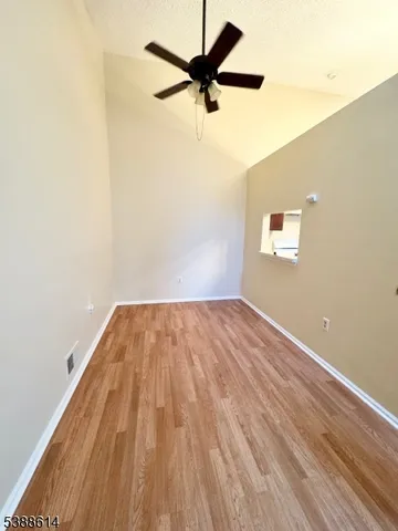 a view of room with a ceiling fan