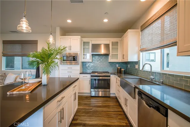 a kitchen with counter top space a sink and cabinets