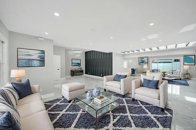 a living room with furniture and a rug