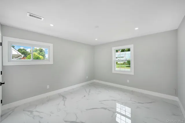 a view of a storage & utility room with racks on the wall