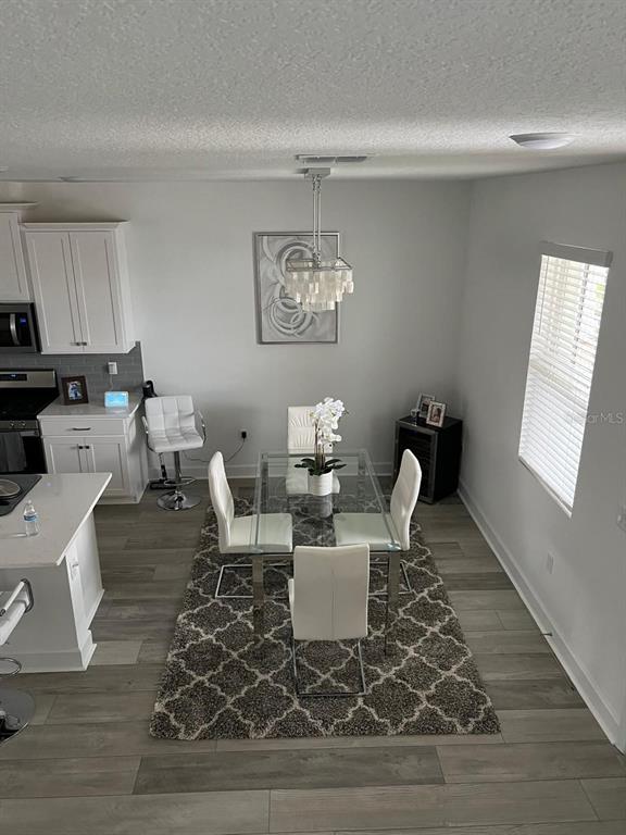 2252 Celebration Boulevard Celebration, FL 34747 - Photo 15 of 40 a view of a dining room with furniture