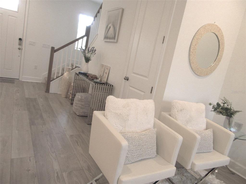 2252 Celebration Boulevard Celebration, FL 34747 - Photo 19 of 40 a living room with furniture and a wooden floor