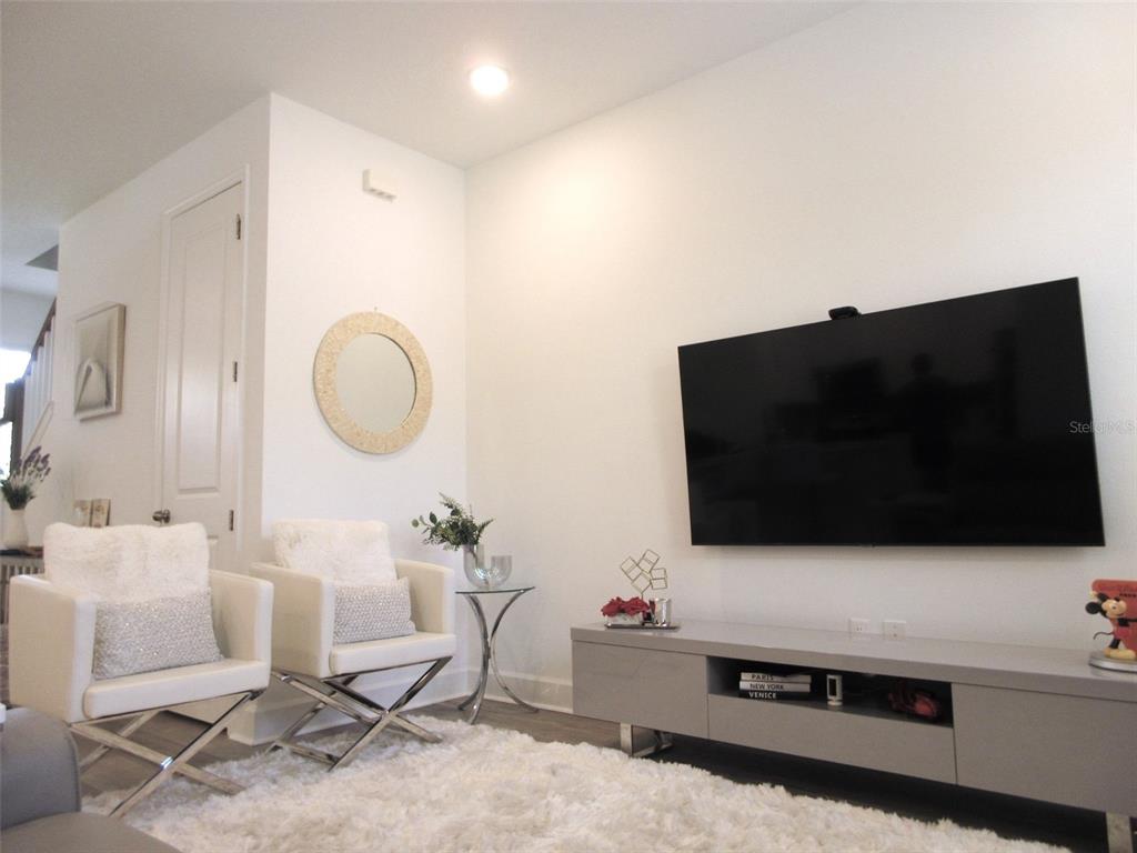 2252 Celebration Boulevard Celebration, FL 34747 - Photo 20 of 40 a living room with furniture and a flat screen tv