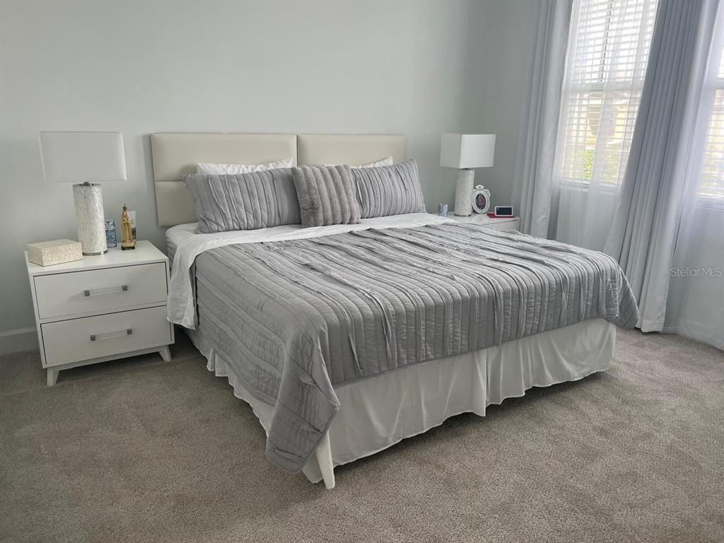 2252 Celebration Boulevard Celebration, FL 34747 - Photo 23 of 40 a bedroom with a bed and window